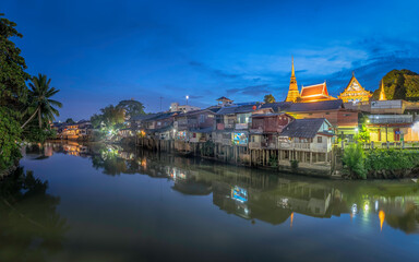 Fototapeta premium Panorama picture of old community houses on the waterfront market Chanthaburi, Thailand, before nightfall