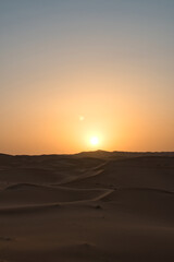 Dunes in the Sahara desert at sunrise, the desert near the town of Merzouga, a beautiful African landscape