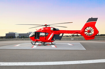 Air transportation. Helicopter. Air ambulance. Red color helicopter. Great photo on the theme of air medical service, air transportation,  air ambulance,  fast city transportation or helicopter tours. © VO IMAGES