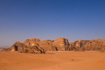 Fototapeta na wymiar Wadi Rum Desert landscape in Jordan. Dunes and mountains. Travel and tourism concept.