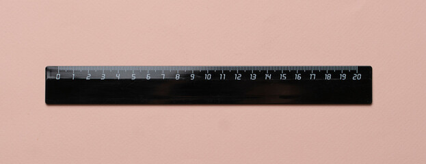 twenty centimeters black ruler isolated on pastel background