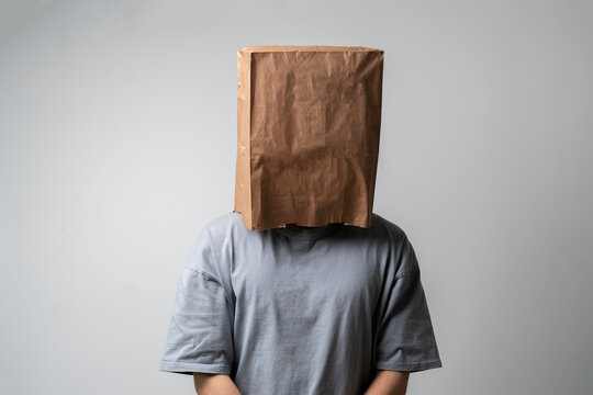 person with blank paper bag on head, mockup template