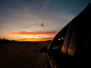 Fototapeta na wymiar Car in sunset view on La Guajira, Colombia