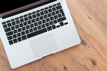freelance work. laptop on a wooden table.