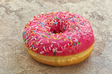Sweet glazed struwberry donut with icing