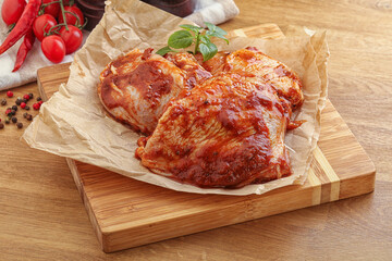 Marinated chicken leg in tomato sauce