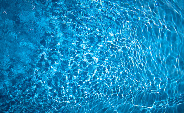 Photo of blue water in the pool. The texture of clear refreshing water. Refresh yourself with water.