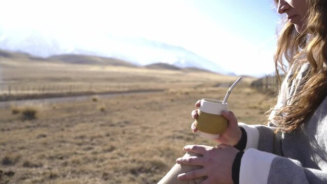 WOMAN DRINKING MATE, TYPICAL DRINK OF SOUTH AMERICA