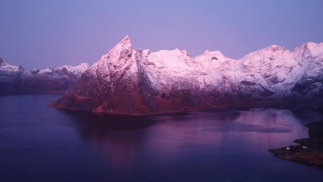 Picturesque fjord with rocky mountains under twilight sky