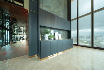 Empty room of luxury modern kitchen area and cabinet decoration on condominium lounge, interior design.