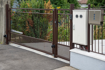 Gate with electric opener  and outdoor electricity meter box cover and mailbox