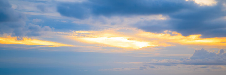 Beautiful sky with bright sunset (sunrise) and clouds. Wide photo.