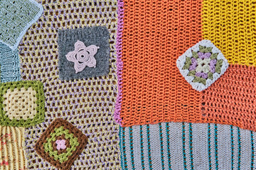 Colourful patchwork abstract background. Different pieces, knitted and crocheted are into one canvas