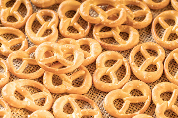 pretzels on the surface, lots of randomly arranged golden pretzels