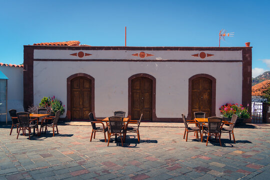 Street cafe with table and chairs in city