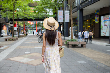 Tourist woman walk in  Xinyi district in Taipei city of Taiwan