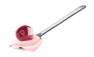Spoon of fruit yogurt with cherry on top