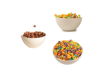 Chocolate corn flakes falling to the white bowl isolated on white. Motion.