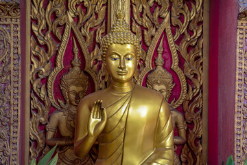 Golden Buddhas  statue in a temple in Thailand