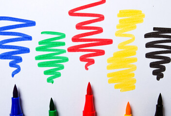 Watercolor pens brush, assortment, on a drawing album, artist's desk, top view, close-up, selective...
