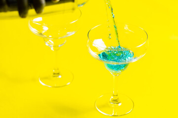 Bartender pouring Blue Lagoon  curacao syrup mixed with vodka and lemonade