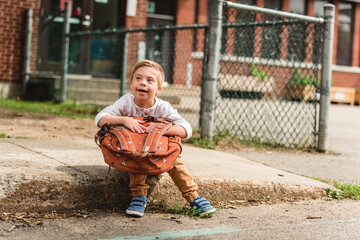 Portrait of a little schoolboy with down syndrome