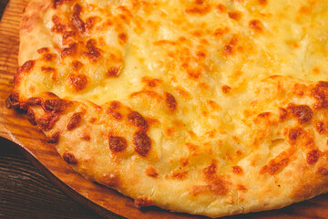 Imereti khachapuri, Traditional Georgian dish, flatbread with cheese, top view, no people, rustic,
