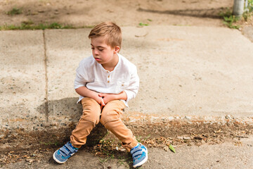 Portrait of a little schoolboy with down syndrome