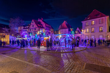 A beautiful cityscape at the famous Christmas market in Colmar in France. - obrazy, fototapety, plakaty