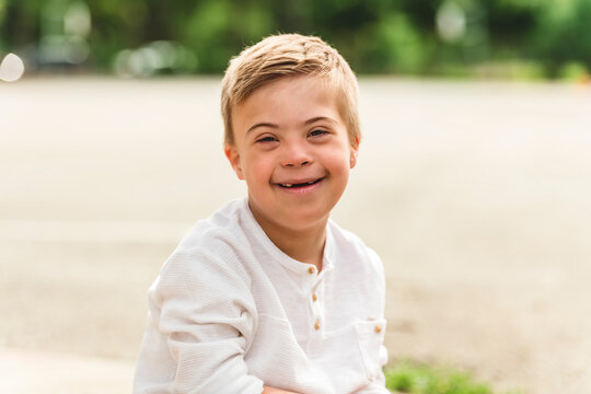 Portrait of a little schoolboy with down syndrome