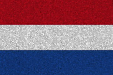 Flag of the Netherlands on styrofoam texture. national flag painted on the surface of plastic foam