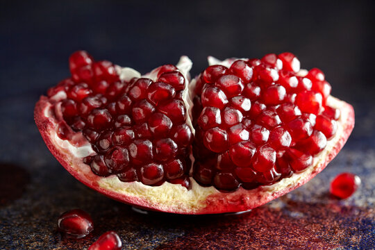 Close-up of pomegranate slice on table