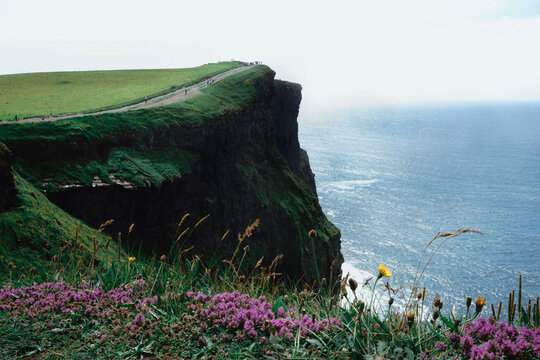 Cliffs of Moher amidst sea against clear sky