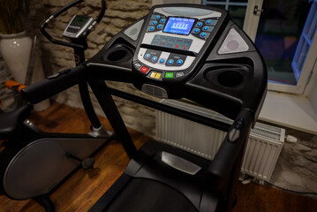 Fototapeta na wymiar Dashboard of sports treadmill at the home gym.
