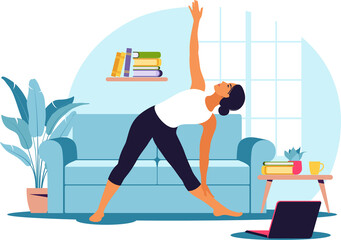 Online workout. Woman doing yoga at home. Watching tutorials on a laptop. Sport exercise in a cozy interior. 