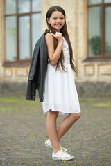 cheerful pretty teen girl. adorable girl fashion model. teenager girl posing outdoor