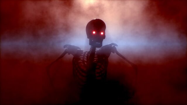 Scary skeleton with glowing eyes is crawling in the fog right at you. Halloween concept.