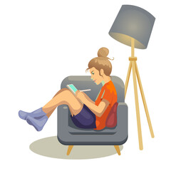 A girl draws on a tablet in a chair