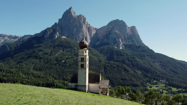 St Valentin Chapel, San Valentino in Kastelruth, Castelrotto, South Tyrol Italy. Italian Dolomites aerial view. Trentino Alto Adige.