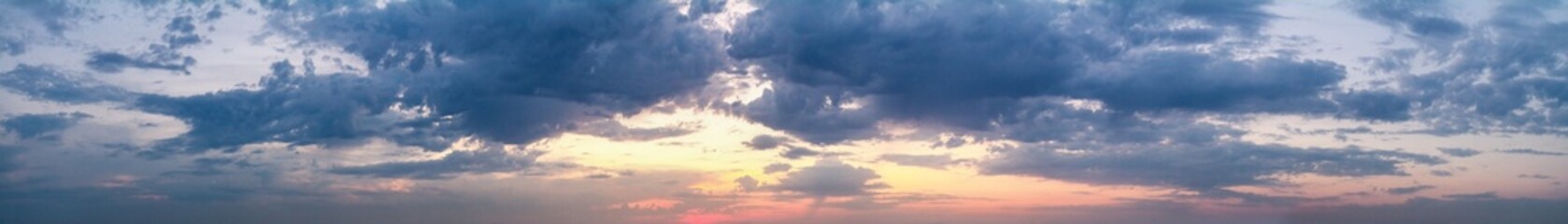 Naklejka na ściany i meble Beautiful summer sunset with a cloudy sky, panorama, banner