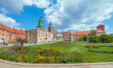 The Wawel Royal Castle, a castle residency located in central Krakow. Tourists exploring the Wawel Hill, the most historically and culturally important site in Poland.