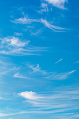 Fototapeta na wymiar Wispy clouds in a blue sky.