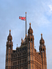 Fototapeta na wymiar The Union Flag flying at half-mast on the Victoria Tower