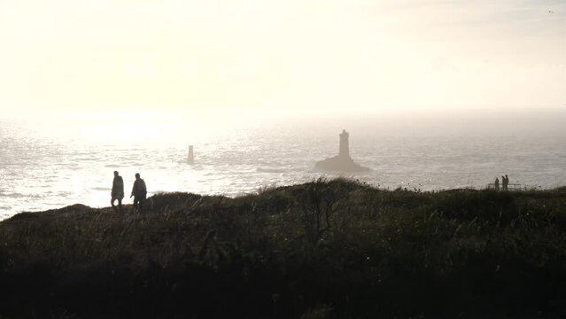 The lighthouse "la Vieille" and the "Pointe du Raz", a famous cape in the west of France during sunset.