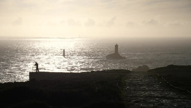 The lighthouse "la Vieille" and the "Pointe du Raz", a famous cape in the west of France during sunset.