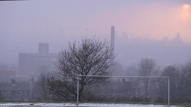 Snowfall in Oldham Greater Manchester at Sunset