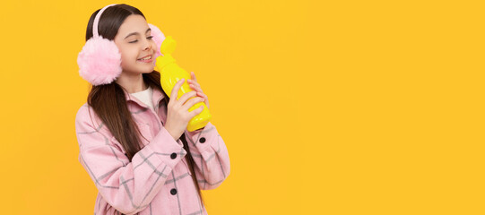 Beverage has never been this tasty. Happy child drink beverage product. Bottled water or juice. Horizontal poster of isolated child face, banner header, copy space.