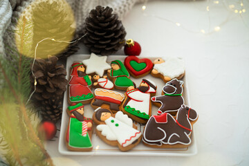 Christmas gingerbread cookies with Christmas decorations. Christmas composition. Traditional Christmas baking. Flat lay, top view, copy space.
