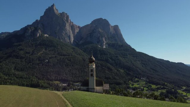 St Valentin Chapel, San Valentino in Kastelruth, Castelrotto, South Tyrol Italy. Italian Dolomites aerial view. Trentino Alto Adige.