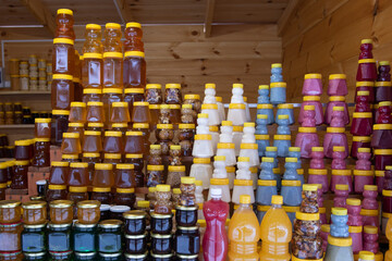 Bottles with honey, nuts, jam and others